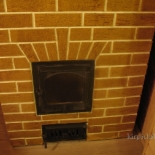 облицовка керамической плиткой печей Перемычка над дверкой